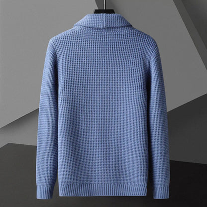Back view of the Domenico Cable Wool Cardigan in blue – elegant men’s knitwear with waffle texture and ribbed cuffs by Polumi.
