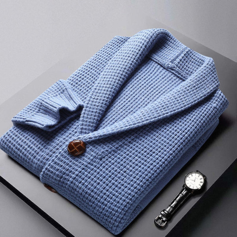 Folded Domenico Cable Wool Cardigan in blue – soft textured knitwear for men, elegant presentation with button detail and minimalist luxury by Polumi.