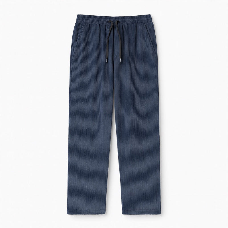 Emanuele Corduroy Pants in blue – men's ribbed corduroy trousers with drawstring waist, displayed flat on white background by Polumi.