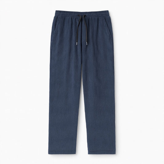 Emanuele Corduroy Pants in blue – men's ribbed corduroy trousers with drawstring waist, displayed flat on white background by Polumi.