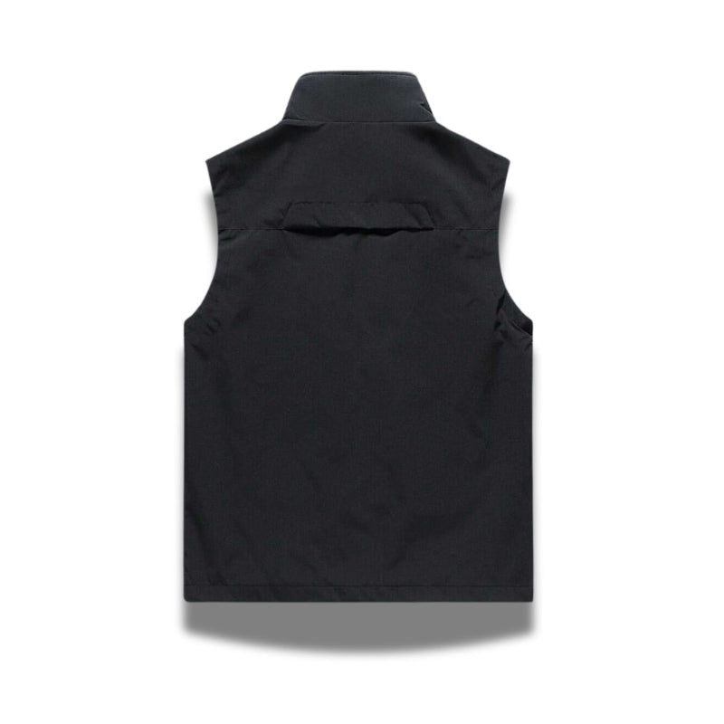 Back view of Ennio Zip Adapt Vest in black – sleek and durable men’s sleeveless jacket ideal for layering by Polumi.