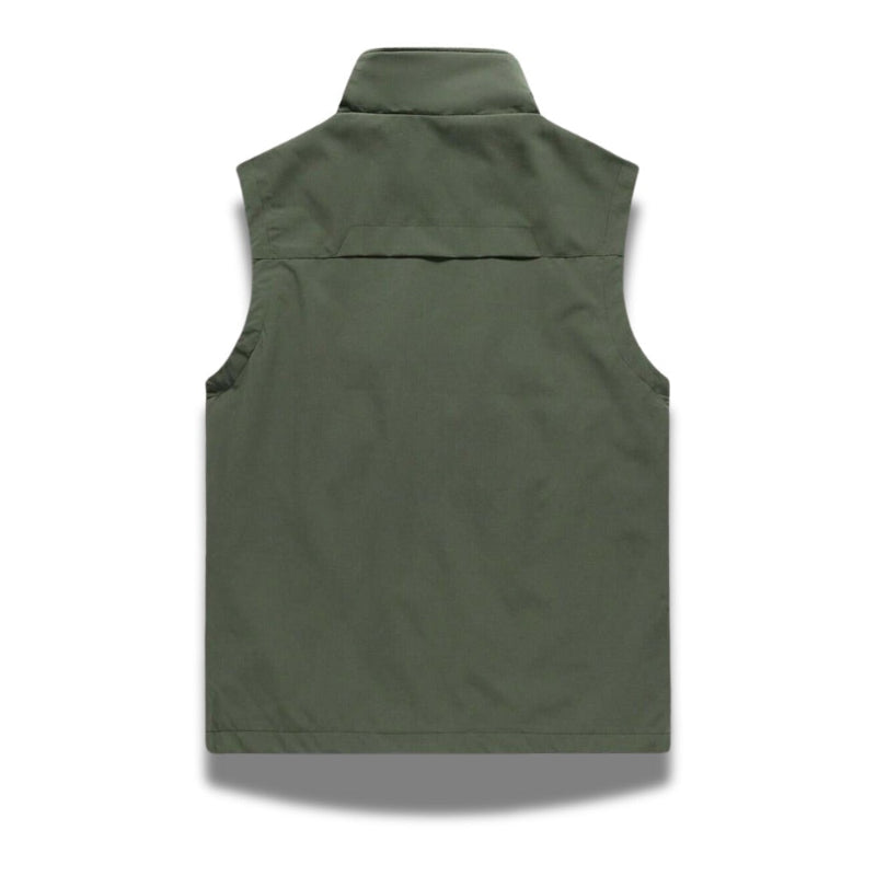 Back view of Ennio Zip Adapt Vest in green – minimalist men’s outdoor vest designed for breathable comfort by Polumi.