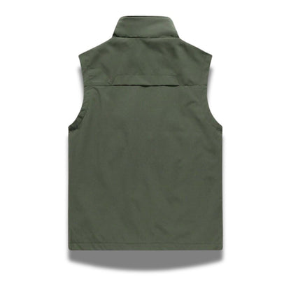Back view of Ennio Zip Adapt Vest in green – minimalist men’s outdoor vest designed for breathable comfort by Polumi.