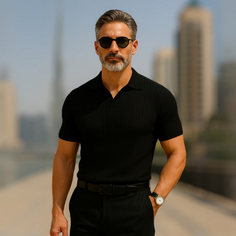 Mature man wearing black Ermenegildo Flex Knitted Polo in Dubai, sophisticated men’s style by Polumi.