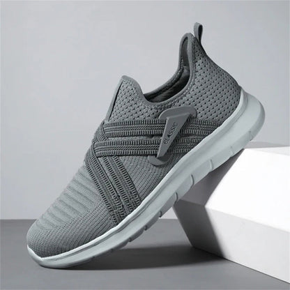 Gray Francesco Premium X Sneakers featuring cross strap design and cushioned sole for comfort and everyday wear