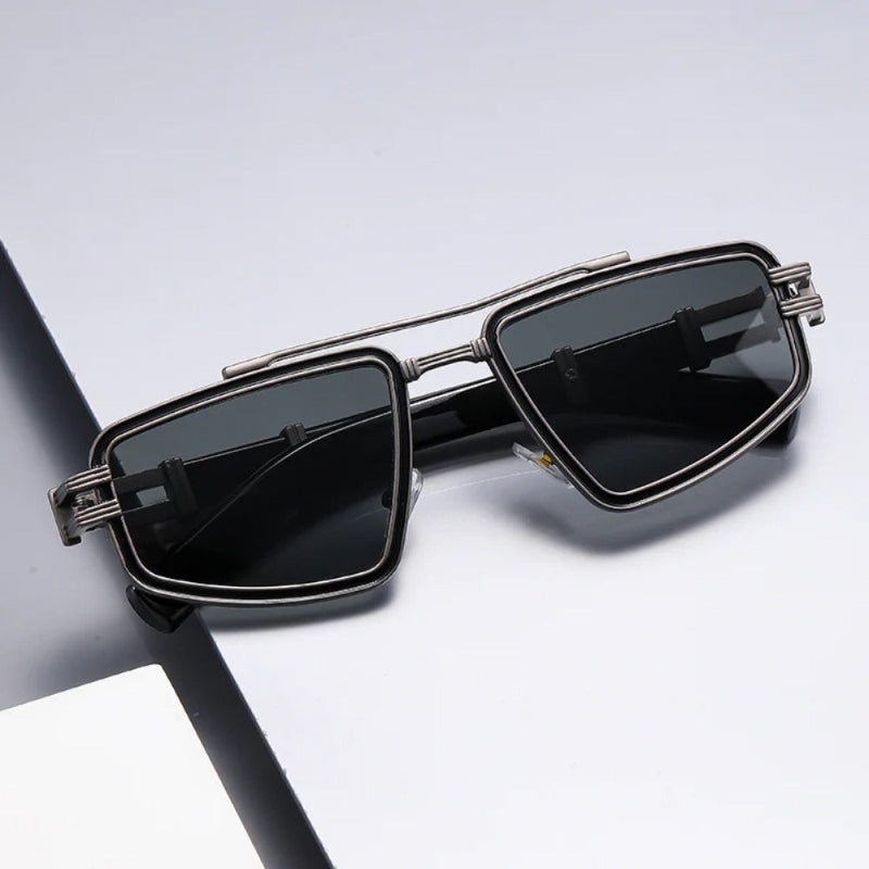 Modern geometric sunglasses with silver frame and black dark lenses – urban and sophisticated unisex eyewear.