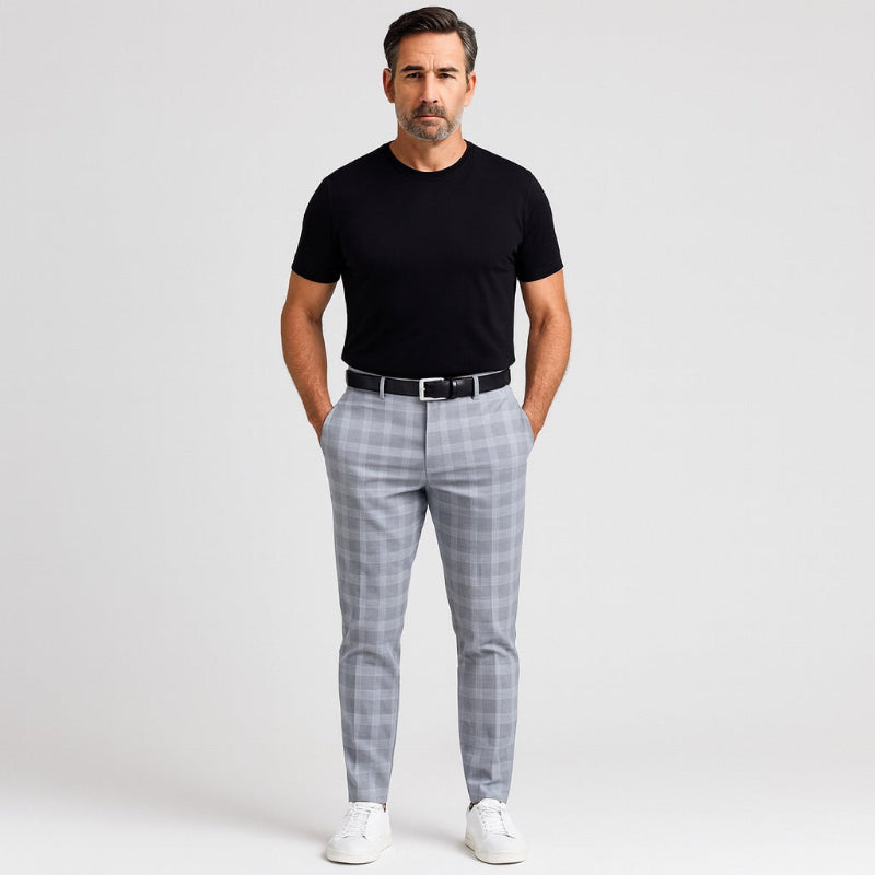 Model wearing Giacomo Timeless Check Pants in sky blue with black T-shirt, black belt, and white sneakers – Polumi contemporary men’s fashion.