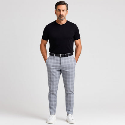 Model wearing Giacomo Timeless Check Pants in sky blue with black T-shirt, black belt, and white sneakers – Polumi contemporary men’s fashion.