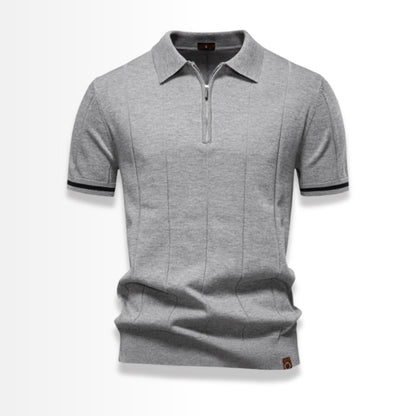 Gray knit polo shirt for men with short sleeves and zip collar.