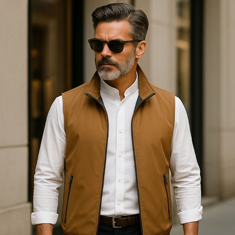 Man wearing Luca Highland Adapt Vest in Timber Brown paired with white shirt walking in city street