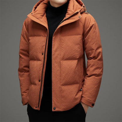 Ludovico Luxe Down Jacket in orange – modern men’s puffer jacket with quilted texture and hood, designed for warmth and urban style by Polumi.