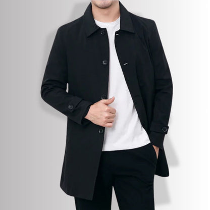 Black Massimo Exclusive Trench Coat closed front view, showcasing minimalist silhouette and sleek finish.