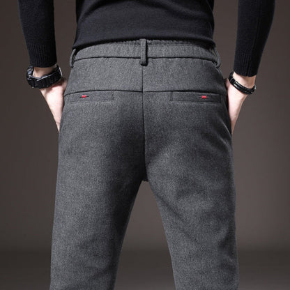 Back view of gray Massimo Modern Slim Pants with minimalist design and subtle red stitch details.