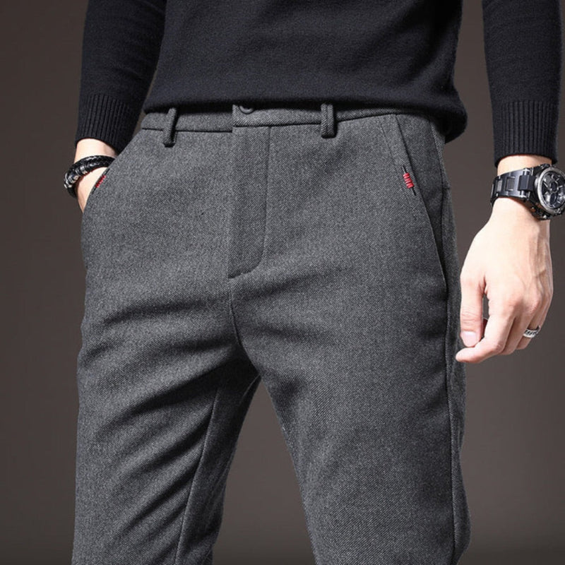 Close-up of gray Massimo Modern Slim Pants showing fine wool texture and red stitch detail near pocket.