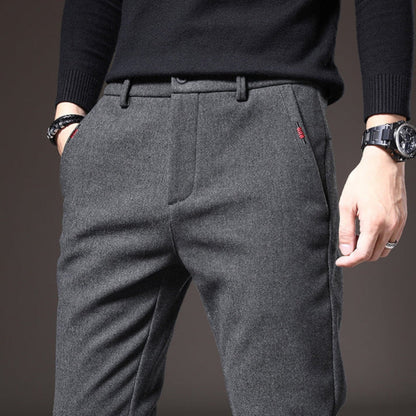Close-up of gray Massimo Modern Slim Pants showing fine wool texture and red stitch detail near pocket.
