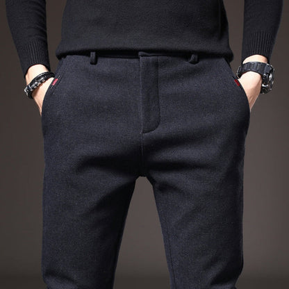 Close-up of navy Massimo Modern Slim Pants highlighting tailored waistband and side pockets.
