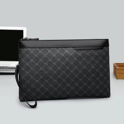 Elegant men’s black clutch bag in leather with wrist strap.