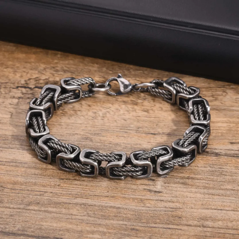 Gunmetal men’s rope chain bracelet with square links and textured design, durable stainless steel accessory for masculine style.