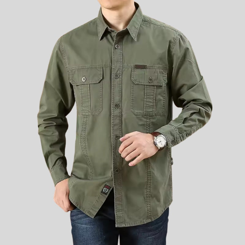 Male model wearing men’s army green cotton shirt with chest pockets – casual outdoor style.