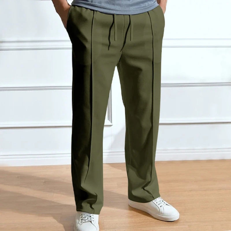 Men’s army green relaxed fit trousers with drawstring waistband and tailored straight leg.