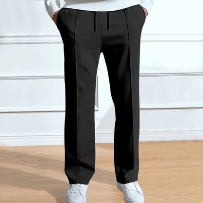 Men’s black relaxed fit trousers with crease detailing and adjustable drawstring waist.