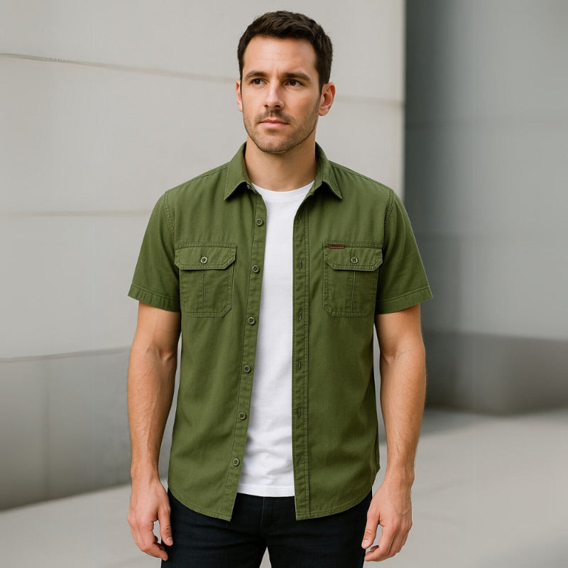Model wearing men’s short sleeve green casual shirt with white T-shirt underneath.