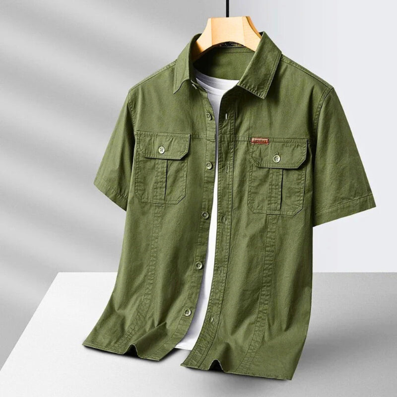 Men’s short sleeve casual shirt in green with button-down front and dual chest pockets.