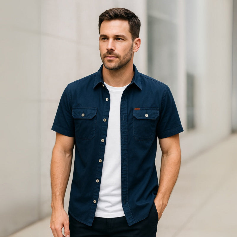 Model styled in navy blue men’s short sleeve casual shirt with classic fit.