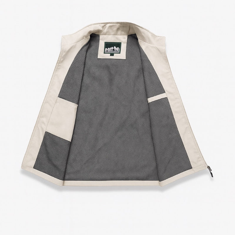 Men’s utility vest in ivory, inside view with breathable mesh lining and inner storage pockets.