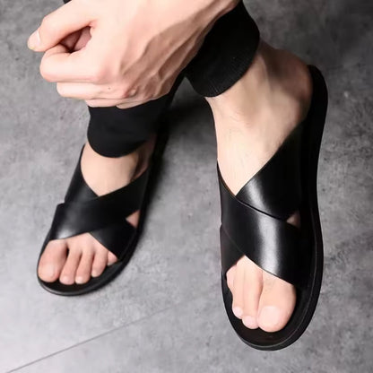 Black Milano men’s leather sandal worn on foot, casual style.