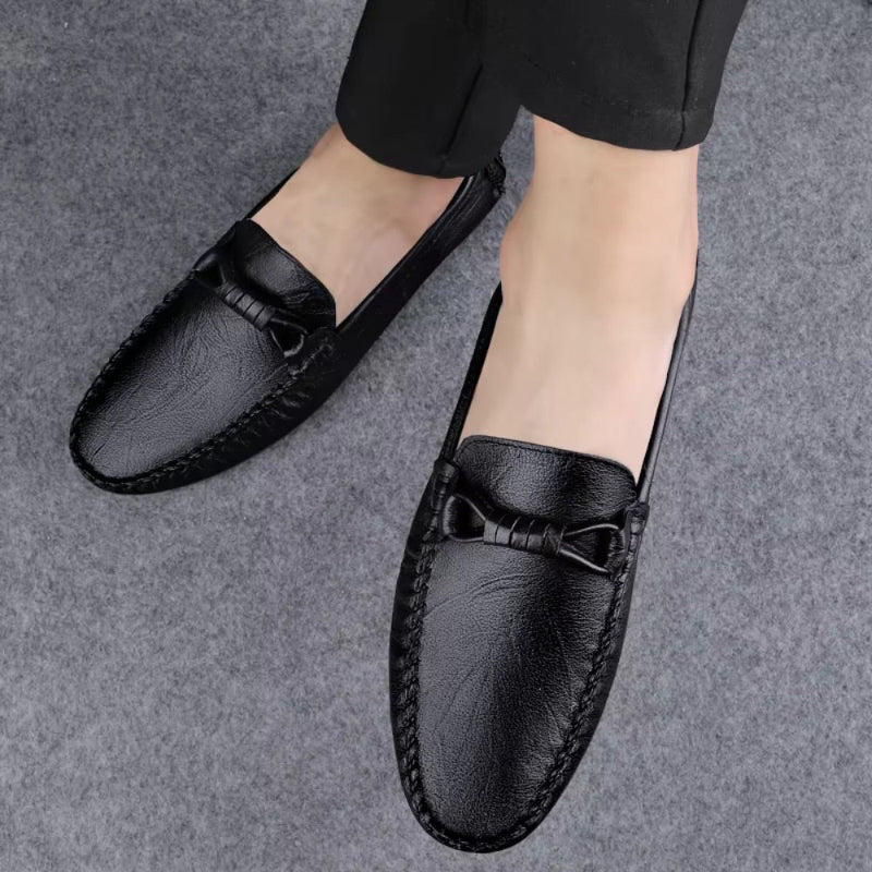 Niccolò Genuine Leather Moccasin in hammered black – top view of men's elegant loafers on feet, showcasing bow detail and premium hand-sewn finish by Polumi.