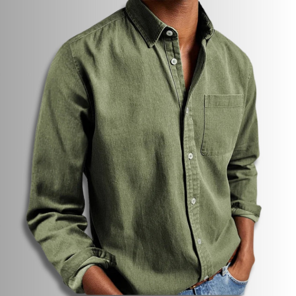 Green button-up shirt worn by a person on a gray background