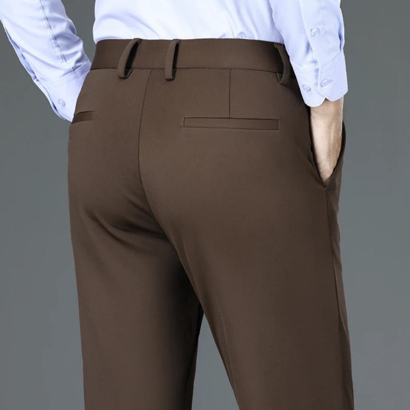 Back view of Polumi Fabio Luxe Office Slacks in brown — premium men’s tailored pants with sleek rear pockets and modern fit.