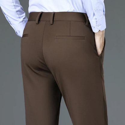 Back view of Polumi Fabio Luxe Office Slacks in brown — premium men’s tailored pants with sleek rear pockets and modern fit.