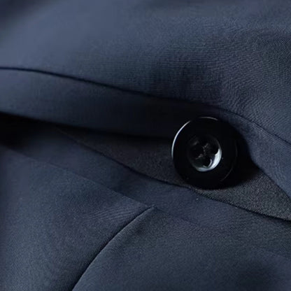 Close-up of Polumi Fabio Luxe Office Slacks navy fabric and button — showcasing premium craftsmanship and smooth texture.