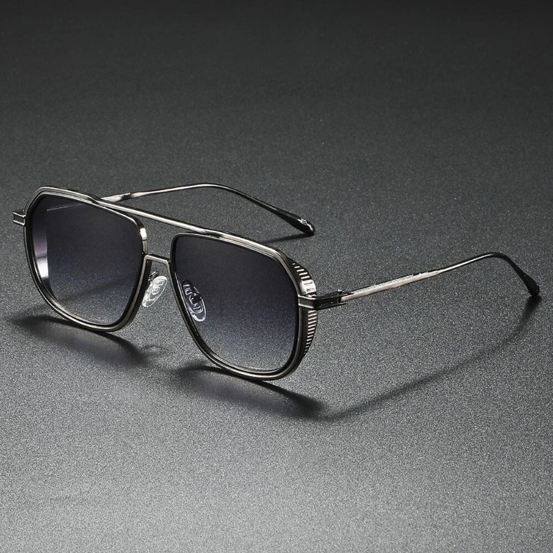Classic aviator sunglasses with black metal frame and gray gradient lenses, stylish men’s accessory.