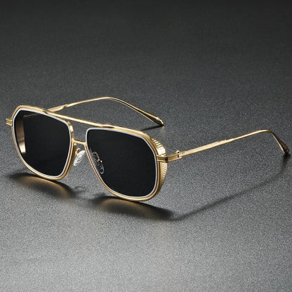 Luxury aviator sunglasses with golden metal frame and black lenses, modern men’s fashion accessory.