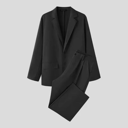 Torino Men’s Soft Suit in black laid flat, showing premium fabric and soft silhouette.
