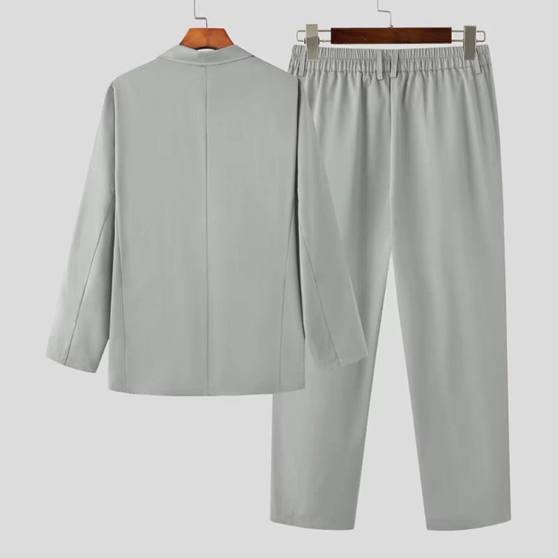 Back view of Torino Men’s Soft Suit in light gray, featuring smooth drape and relaxed design.
