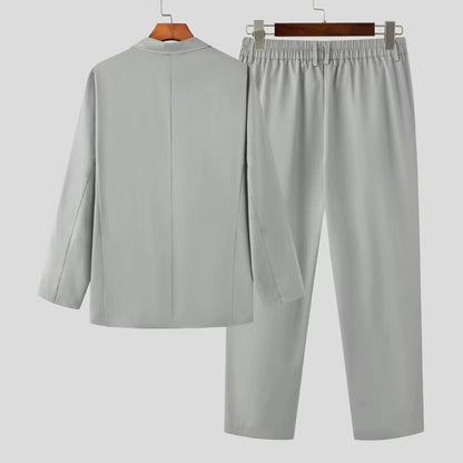 Back view of Torino Men’s Soft Suit in light gray, featuring smooth drape and relaxed design.
