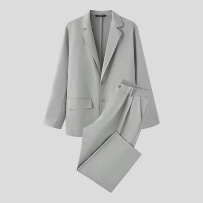 Torino Men’s Soft Suit in light gray laid flat, showing soft material and modern tailoring.
