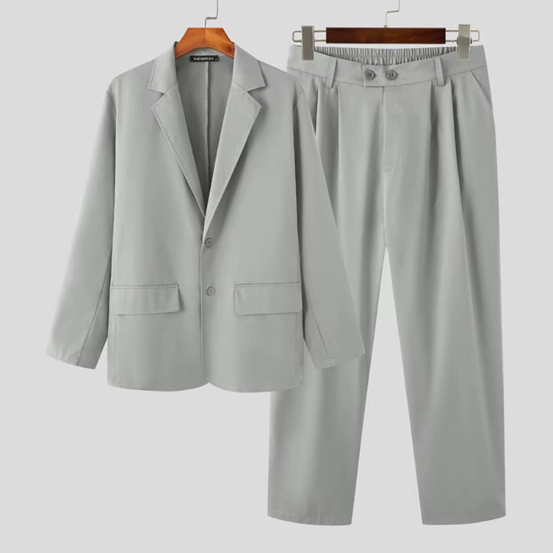 Torino Men’s Soft Suit in light gray, front view of minimal blazer and trousers for men.
