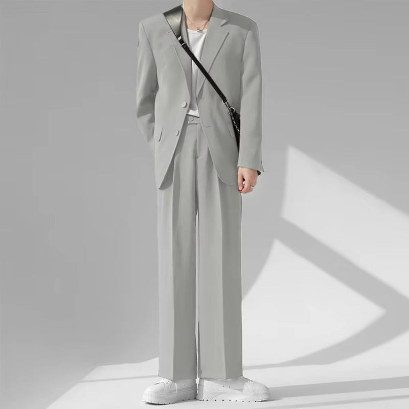 Model wearing Torino Men’s Soft Suit in light gray, casual Italian-inspired elegance.