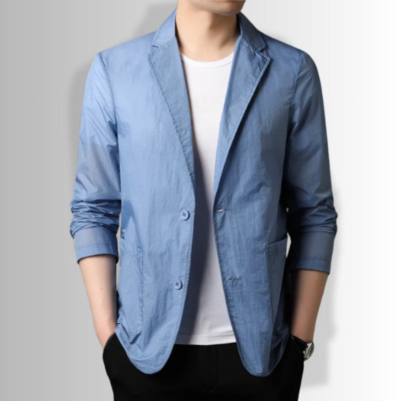 Man wearing Valerio Cascade Blazer in blue with white t-shirt and black pants.