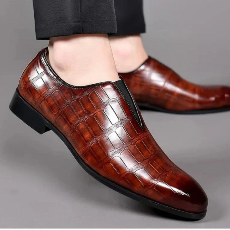 Valerio Leather Loafers in brown, stylish men’s shoes worn with black pants for a refined look.