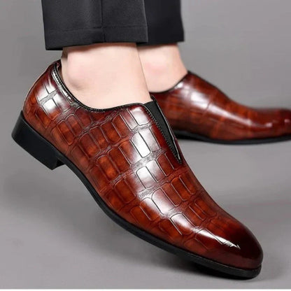 Valerio Leather Loafers in brown, stylish men’s shoes worn with black pants for a refined look.