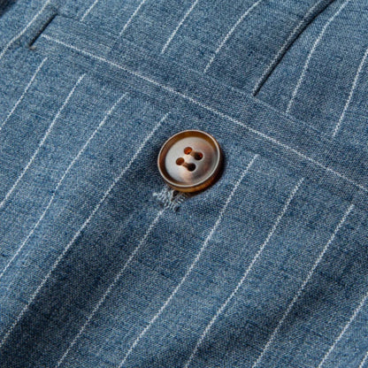 Close-up of button detail on blue Valerio Poldini relaxed men's pants

