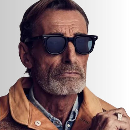 Mature man wearing Venezia Italian Featuring Sunglasses by Polumi – vintage square black frame with blue lenses, inspired by classic Italian design.