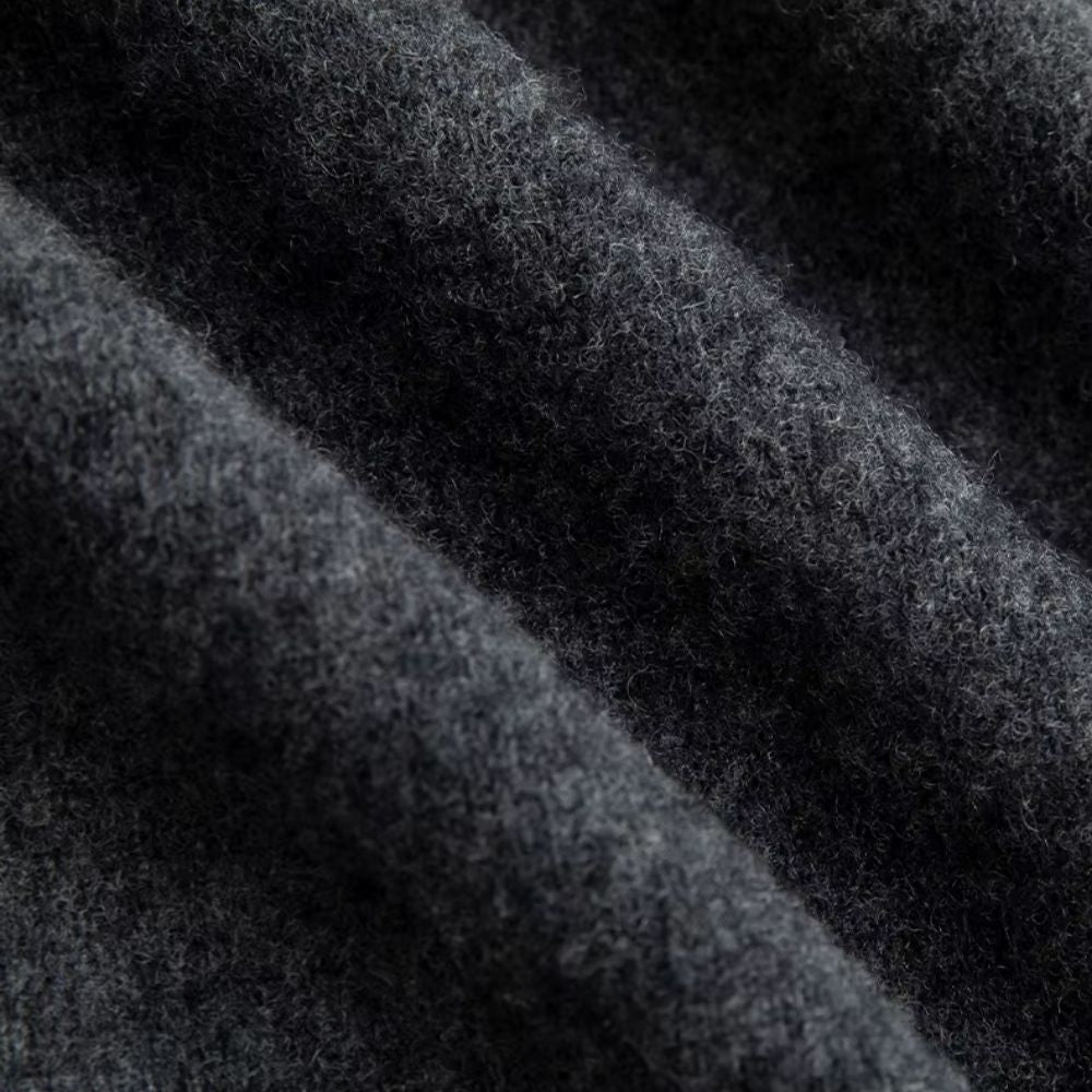 Close-up of Polumi grey wool knit fabric – soft breathable texture for men’s premium sweaters