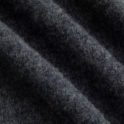 Close-up of Polumi grey wool knit fabric – soft breathable texture for men’s premium sweaters
